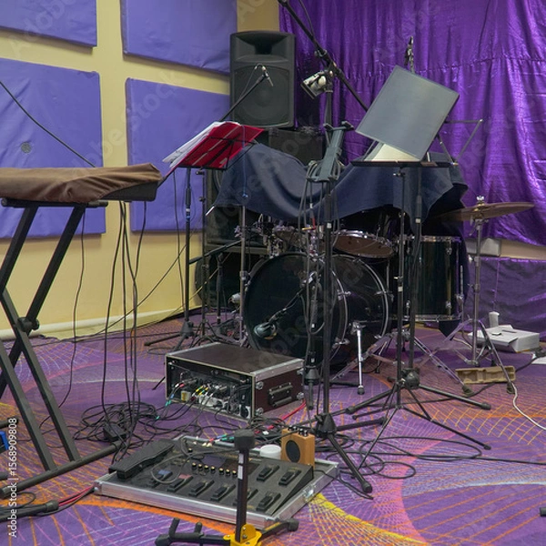Obraz View of the interior of the rehearsal room. View of drums, keyboards and guitar in a case