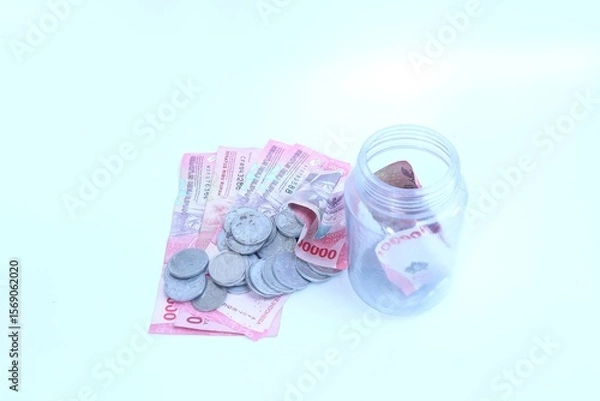 Fototapeta Putting aside money for savings. Saving money for the future