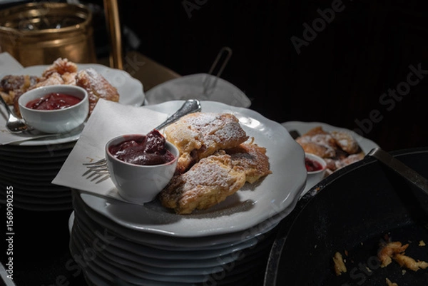 Fototapeta Traditional Viennese Breakfast: Freshly Cooked Kaiserschmarrn with Sweet Plum Compote