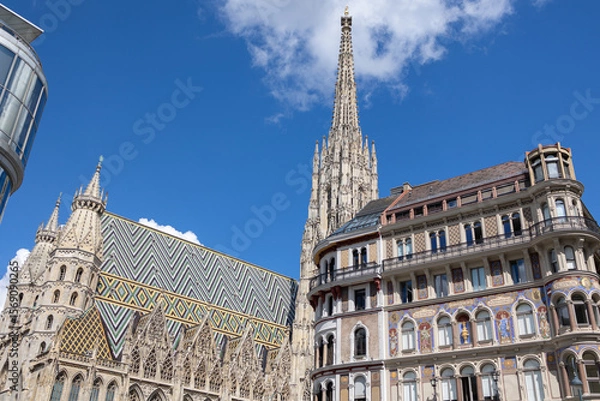 Fototapeta Soaring Spires and Intricate Details, Exterior facade of St. Stephen's Cathedral and neighboring Building  in Vienna, Austria