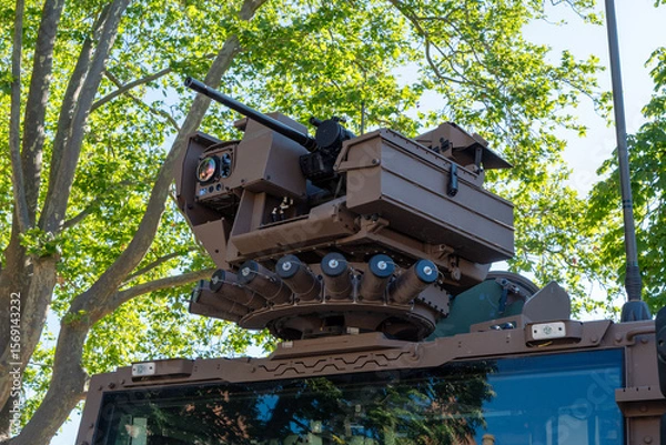 Fototapeta Tank with a gun on top of it