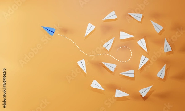 Fototapeta Red paper plane flying away from a group of white planes on orange background. Concept of leadership, innovation, individuality, thinking different, and unique direction.