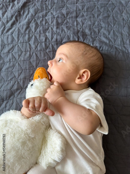 Fototapeta Baby Smiling with Plush Duck Toy