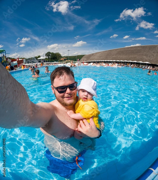 Fototapeta Father and Baby Enjoying Pool Time