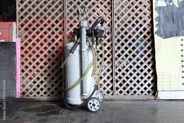 Obraz Air compressor pressure pump tool at garage,service and repair