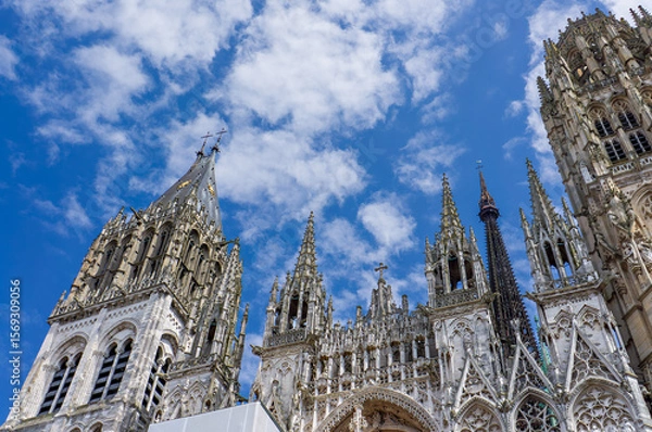 Fototapeta Rouen Cathedral in the city of Rouen, France was opened in 1876. The facade of the Gothic church building, it is famous for its three towers.