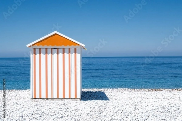 Fototapeta Beach Hut with Striped Roof by the Calm Sea