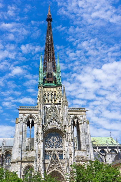 Fototapeta Gothic architecture of Rouen Cathedral showcases intricate details under a bright blue sky