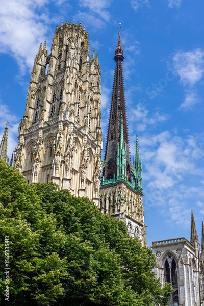 Fototapeta Gothic architecture of Rouen Cathedral showcases intricate details under a bright blue sky