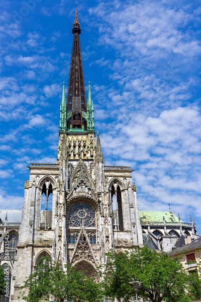 Fototapeta Gothic architecture of Rouen Cathedral showcases intricate details under a bright blue sky