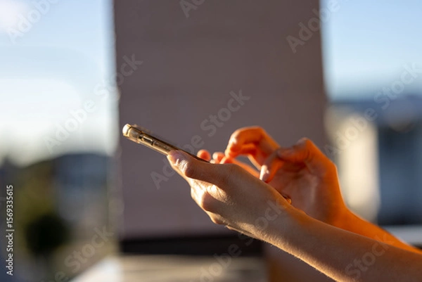 Fototapeta woman using smart phone. The concept of living on vacation and playing social media. Social Distancing ,Working From Home