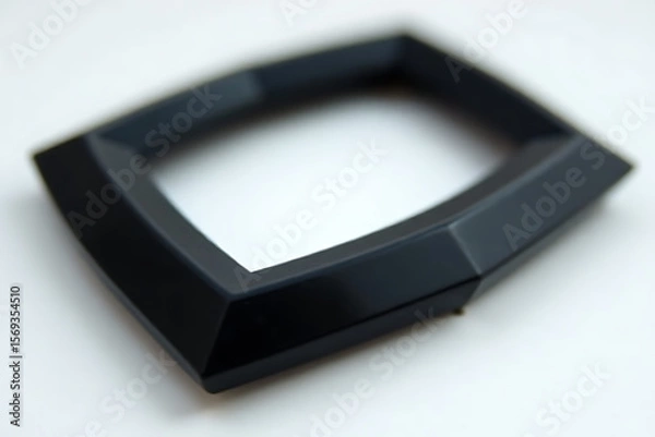 Fototapeta Black plastic frame with beveled edges on a white background.
