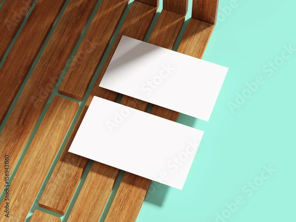 Fototapeta Clean white business card on wooden slats, providing a minimalist look.