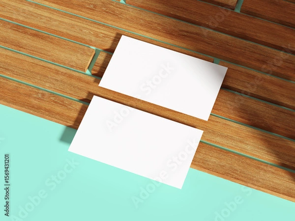 Fototapeta White business card above wooden boards.