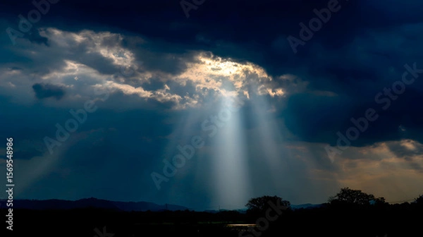 Fototapeta Heavenly light bursts forth, the clouds dispersing to create a sparkling trail marking Christ's glorious comeback