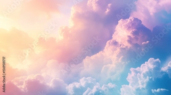 Fototapeta Sublime celestial vista presenting pastel shaded cumulus clouds in dreamy atmosphere