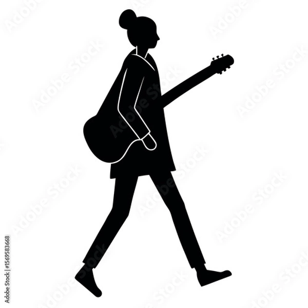 Fototapeta Silhouette of a person walking with an acoustic guitar slung over their shoulder