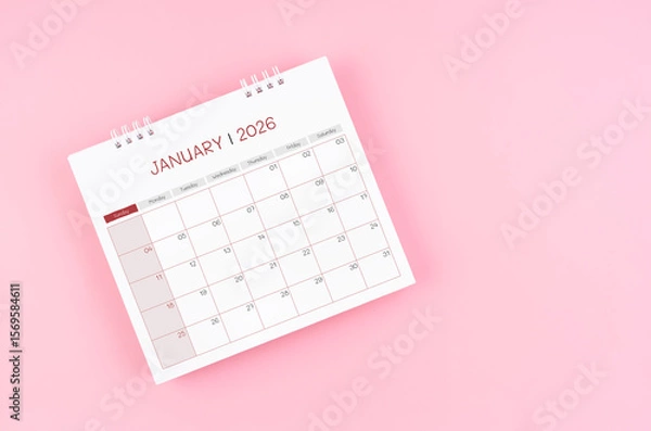 Fototapeta January desk calendar for 2026 year on pink background for schedule to make appointment meeting.