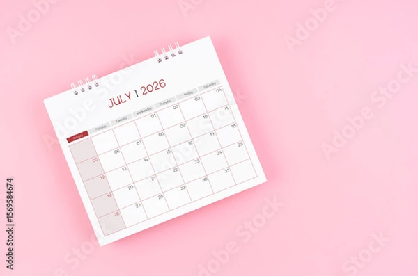 Fototapeta July desk calendar for 2026 year on pink background for schedule to make appointment meeting.