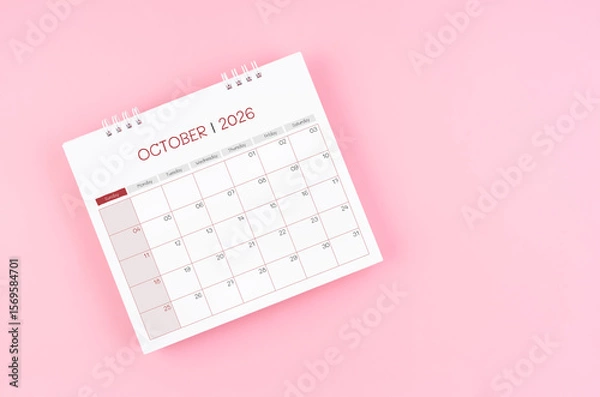 Fototapeta October desk calendar for 2026 year on pink background for schedule to make appointment meeting.