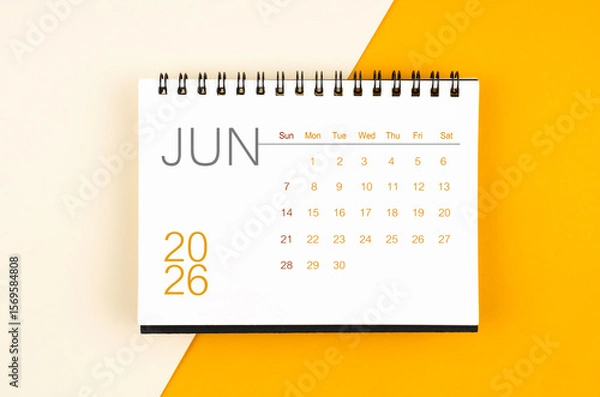 Fototapeta Desk calendar for June 2026 year on yellow color background, Flat lay.