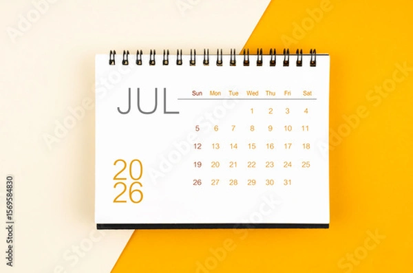 Fototapeta Desk calendar for July 2026 year on yellow color background, Flat lay.