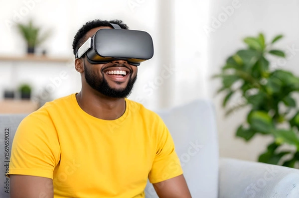 Fototapeta African American Man wearing virtual reality headset and smiling while experiencing immersive technology, symbolizing innovation, entertainment,gaming,for themes of VR,technology,digital experiences