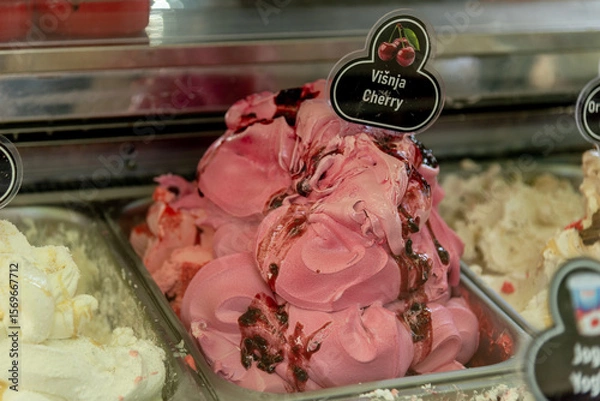 Fototapeta Various Colored Fruit Delicious Ice Cream in Containers on Display Case for Sale
