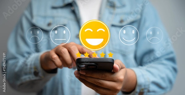 Fototapeta Happy customer providing 5-star review via mobile application after receiving outstanding service and quality product. Online customer feedback plays crucial role in business ranking, Consumer trust