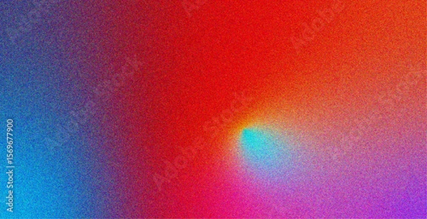 Obraz Abstract colorful gradient background with red, blue, purple, and cyan tones blended through a grainy, noisy texture. The digital noise effect creates a retro, vaporwave-inspired aesthetic perfect for