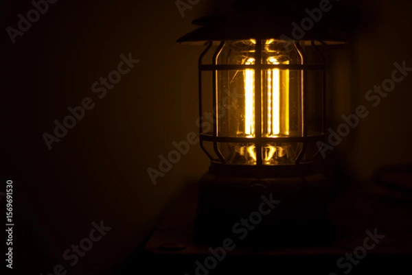 Fototapeta Warm light lantern for indoor use and in the dark
