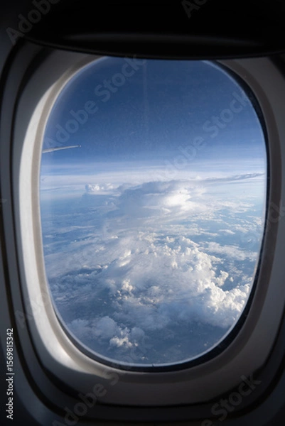 Fototapeta 飛行機の窓から見た空模様