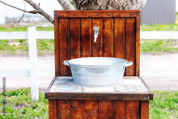 Obraz Rustic outdoor wash basin designed for gardens or farm settings