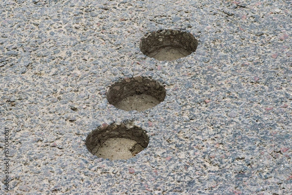Fototapeta inspection round holes in asphalt left after checking the thickness and quality of the asphalt