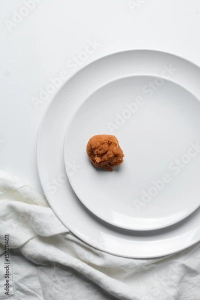 Obraz Overhead view of Akara on a white plate, top view of nigerian akara fried beans cake on a plate