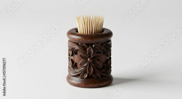 Fototapeta Wooden toothpick holder with intricate floral carvings, showcasing craftsmanship and design, featuring toothpicks arranged neatly, ideal for home decor and dining settings