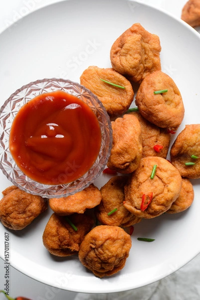 Obraz Overhead view of Akara on a white plate, top view of nigerian akara fried beans cake on a plate
