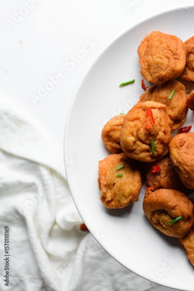 Obraz Overhead view of Akara on a white plate, top view of nigerian akara fried beans cake on a plate