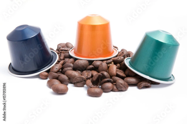 Obraz coffee capsules with coffee beans on white background