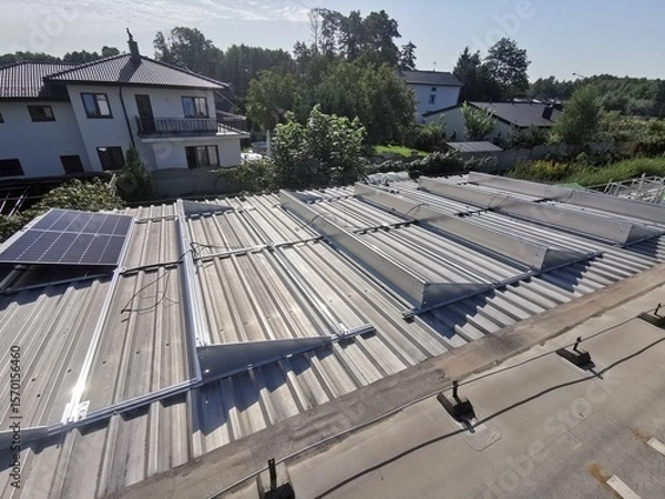Fototapeta Structure on the house roof for solar panels with installed power optimizers