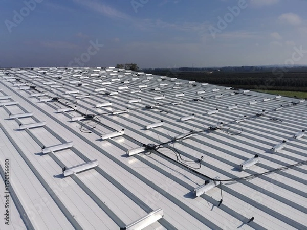 Fototapeta Structure on the house roof for solar panels with installed power optimizers