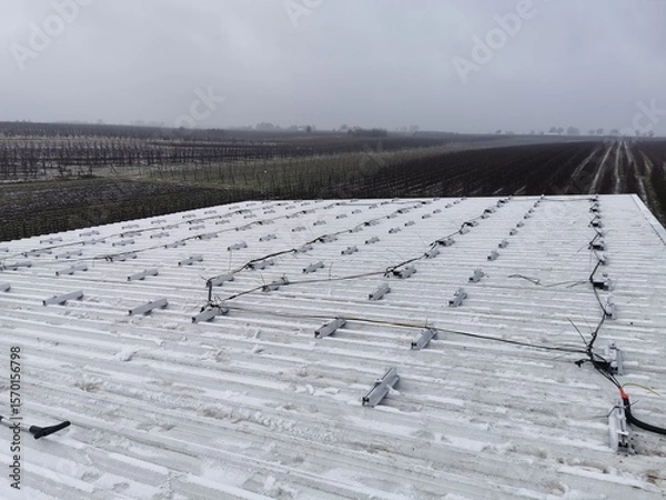 Fototapeta Structure on the house roof for solar panels with installed power optimizers