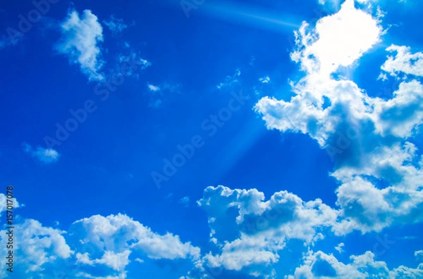 Fototapeta white fluffy clouds in the blue sky