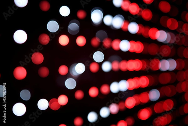 Fototapeta Abstract Luminescence: An artistic portrayal of vibrant red and white bokeh lights against a sleek black backdrop, creating a mesmerizing visual experience.