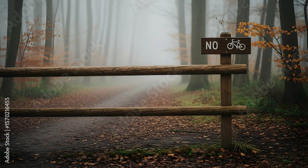 Fototapeta Mystical Autumn Forest Path Blocked by No Bicycles Allowed Barrier