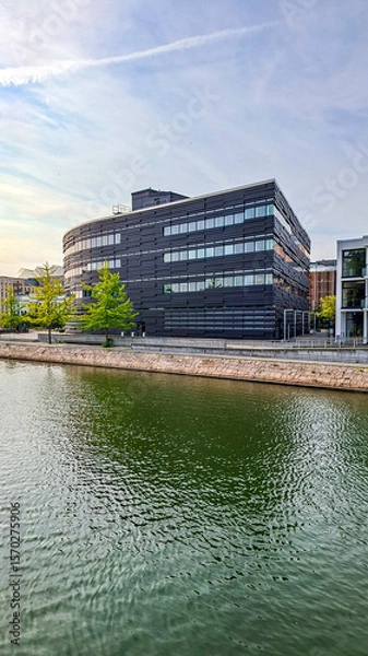 Fototapeta Vertical shot of modern architecture along the waterfront in Malmo, Sweden