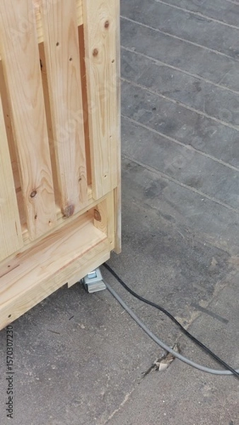 Fototapeta Wooden cat house with acrylic door, mesh panel and built-in litter box