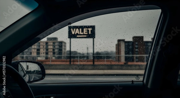 Fototapeta Rainy Day View From Inside Car With Valet Parking Sign Outside