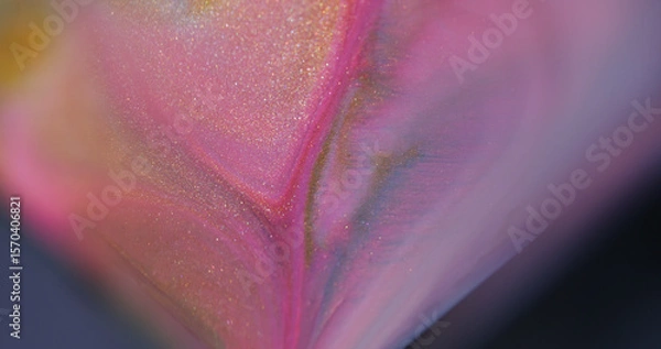 Fototapeta Sparkling paint. Fluid spill. Defocused purple pink yellow colorful splash liquid flowing texture drip on abstract bokeh background.