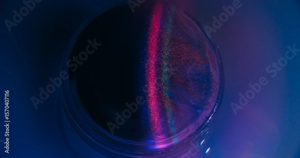 Fototapeta Neon spill. Gleam art. Defocused purple pink blue circle ink bright texture vibrant rainbow stripes floating on abstract fluorescent background.